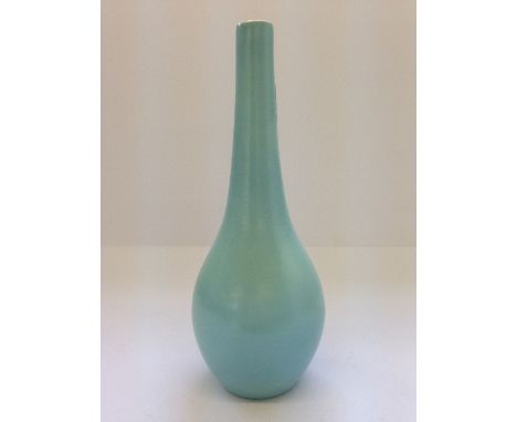 A small Poole Pottery Freeform bottle shape vase in Ice Green glaze.