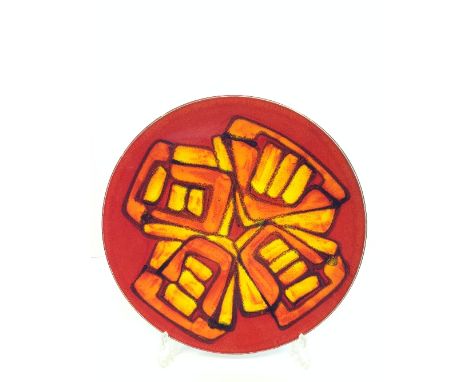 A Poole Pottery Delphis dish, shape 5, decorated in an abstract pattern in tones of orange, yellow and red by Angela Wyburgh 