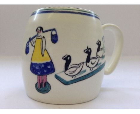 An early 20th century Poole Pottery Nursery mug, decorated in the Play Box pattern, designed by Alfred Read.