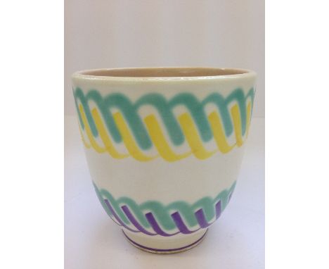 A small Poole Pottery Freeform plant pot, decorated in tones of green, yellow and purple in a Wavy design.