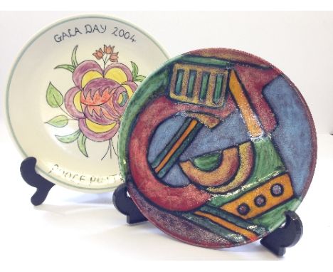 A Poole Pottery 2004 Gala Day plate, decorated in a stylised floral pattern together with a modern Poole Studio dish by Karen