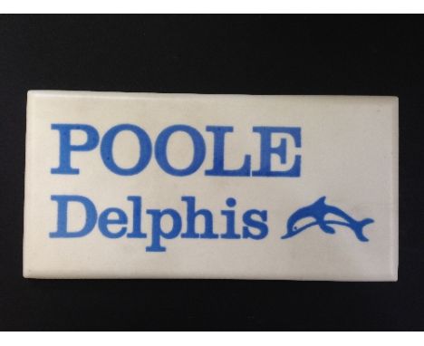 A Poole Pottery earthenware shop display sign/tile: Poole Delphis in blue lettering on white ground, circa 1960's.