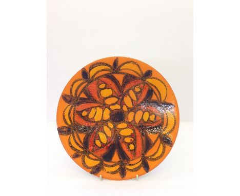 A Poole Pottery Delphis dish, shape 4, decorated in an abstract floral design.