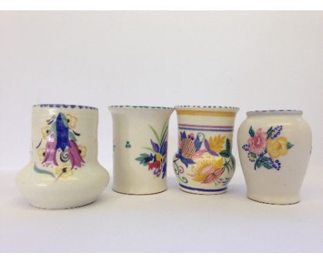 Four various miniature Poole Pottery vases in different patterns.