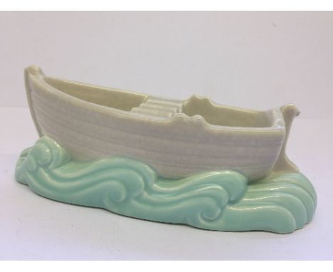 A Picotee glaze Poole Pottery Rowing Boat ashtray, shape 542, in ice green and seagull velum glaze C57 (7" length).