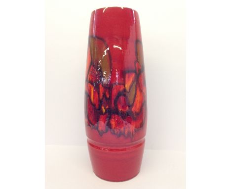 A Poole Pottery vase, shape 85, decorated in an abstract pattern in tones of red, orange and green.