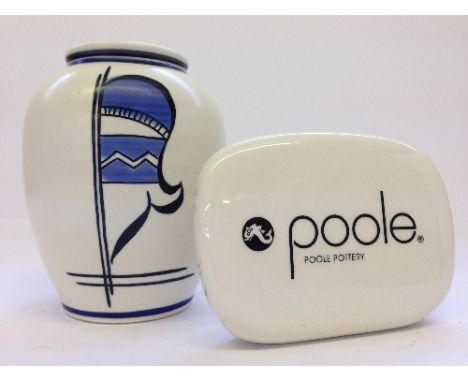 A small Poole Pottery advertising plaque together with a modern Studio vase, decorated with a stylized flower.