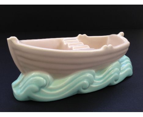 A Poole Pottery Art Deco Rowing Boat ashtray, shape 544, designed by John Adams, decorated in the C96 glaze.