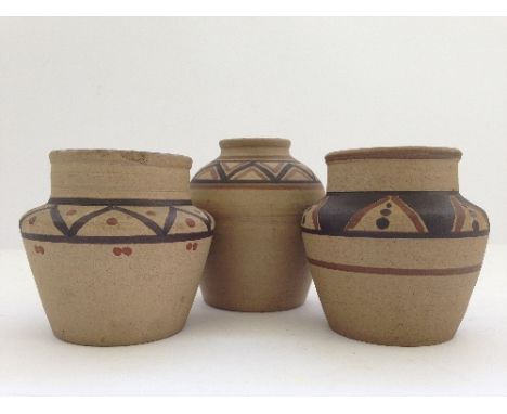 Three various unglazed miniature Poole Pottery vases, in the style of James Radley Young.