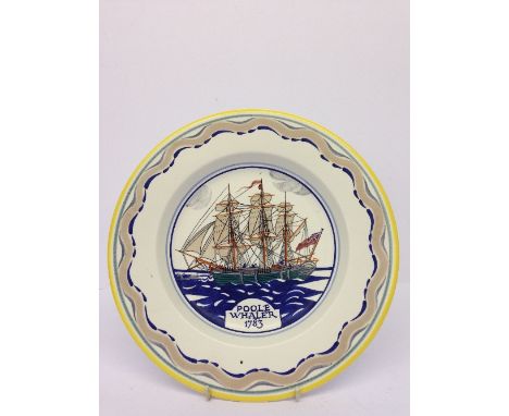 A Poole Pottery dish, decorated with the Poole Whaler 1783, inscribed to reverse 'This dish was made and painted at the Poole