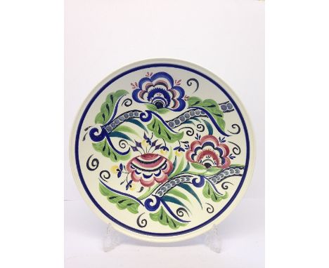 A modern Poole Studio flared dish, decorated in a traditional floral pattern by Sue Pottinger, 1998 (14"). 