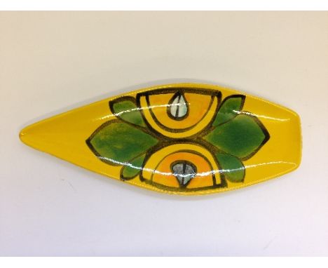 A Poole Pottery spear dish, shape 82, decorated in an abstract pattern in tones of green, black and orange on yellow ground b