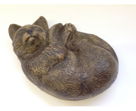 A Poole Pottery Barbara Linley Adams stoneware model of a Sleeping Cat.