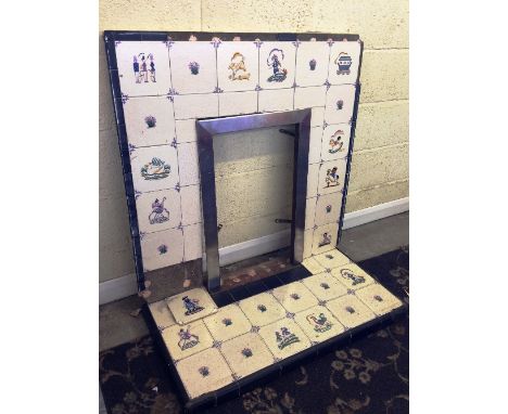 An early 20th century full size fireplace and hearth decorated with Poole Pottery nursery and other tiles.