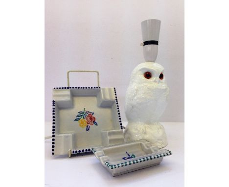 A white glazed Poole Pottery lamp base modelled as an Owl together with two ashtrays.