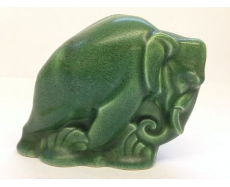 A rare small green glazed Poole Pottery model of an elephant, probably designed by Harold Brownsword, circa 1930 (3").