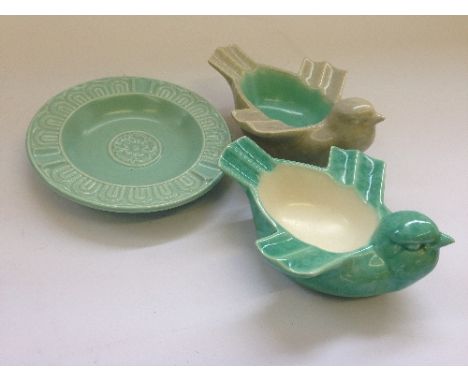 A Poole Pottery Art Deco Bird ashtray, shape 870, designed by John Adams in C65 glaze together another, and a pale green glaz