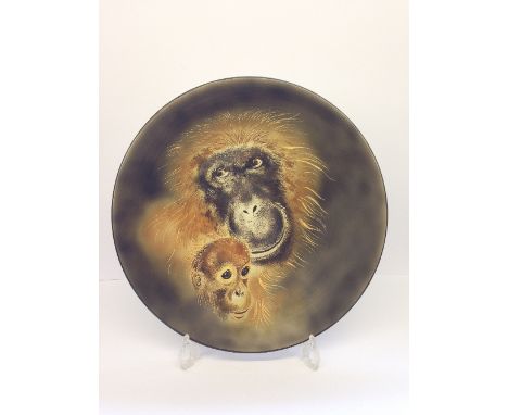 A Poole Pottery One Off Studio charger, hand thrown by Alan White and decorated by Jane Brewer with a portrait of a Mother an