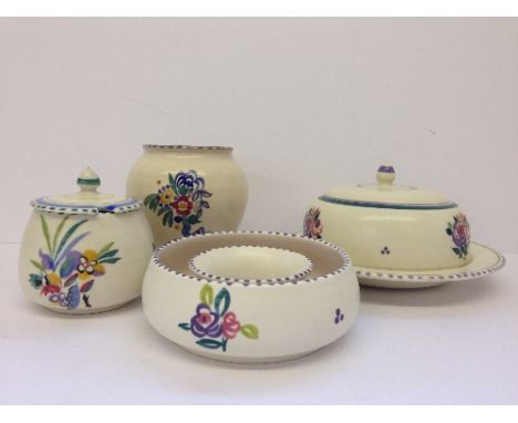 Four various Poole Pottery items including a muffin dish, decorated in the WW pattern, jam pot, circular posy ring and CSA va