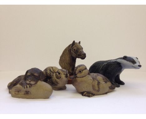 A Poole Pottery Barbara Linley Adams painted stoneware model of a Badger together with unpainted Puppy on a Slipper, Rabbit a