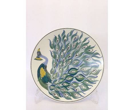 A Poole Pottery dish decorated in a Peacock design by J O Allin (10.25").