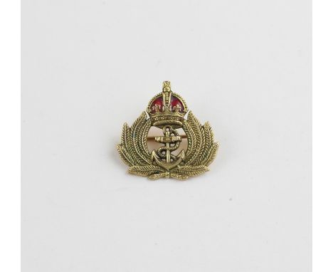 Royal Navy Interest: A 9ct. gold and red enamel Royal Navy crown and anchor badge, verso impressed "9ct", width 27mm. (6g)&nb