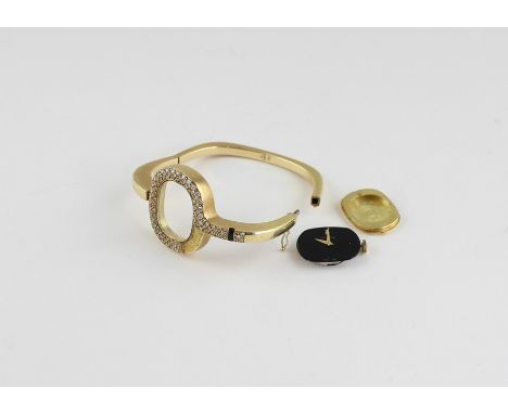 A Corum 18ct. yellow gold ladies' watch, manual wind, having black enamel oval dial with gold alpha hands, 31mm wide case fas