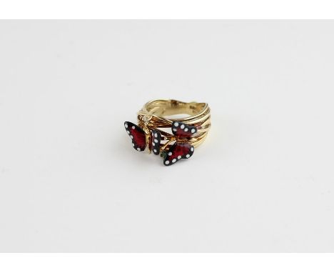 A Roberto Bravo 14ct. yellow gold and enamel "Monarch butterfly" ring,&nbsp;having a wire work band mounted with a pair of re