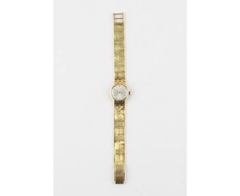 A Tewor 18ct. gold ladies' bracelet watch, manual movement, having signed circular dial with raised gold baton hour markers, 