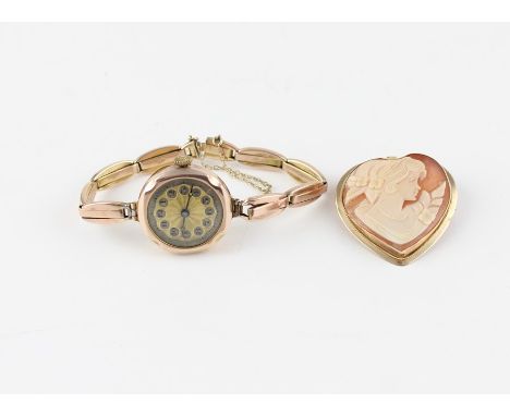 A 9ct. rose gold ladies' bracelet watch, manual movement, having Arabic numeral dial with outer minute track, 25mm wide hallm