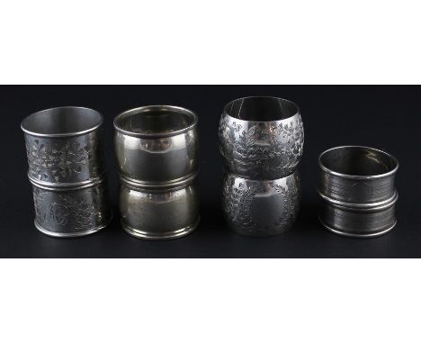 Four pairs of circular silver napkin rings, to include; a pair of Victorian silver napkin rings by Colen Hewer Cheshire, assa