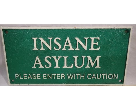 Cast iron Insane Asylum sign, W: 30 cm. P&amp;P Group 1 (£14+VAT for the first lot and £1+VAT for subsequent lots) 