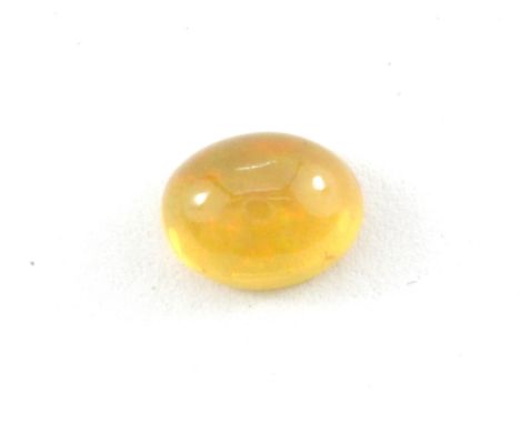 An unmounted natural unheated cabochon cut fire opal, approx. 1.38ct, 9 x 7mm.