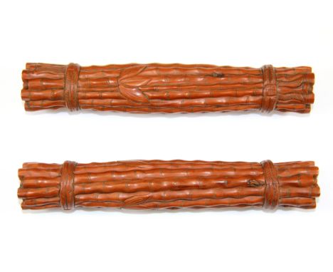 A pair of Chinese carved wood scroll weights, L. 23cm.