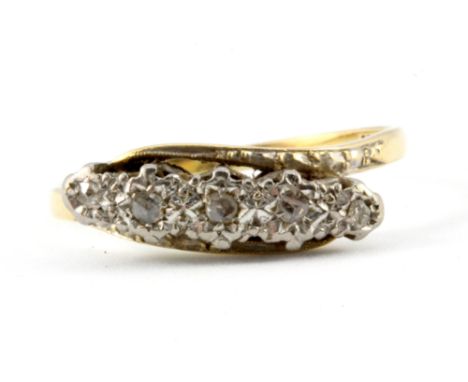 An 18ct yellow gold and platinum diamond set ring, (R.5).