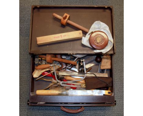 A wooden tool case and contents.