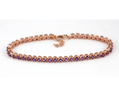 A 925 silver rose gold gilt amethyst set line bracelet.