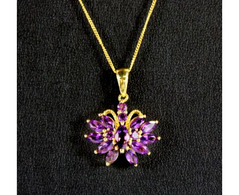 A silver gilt amethyst pendant and chain.