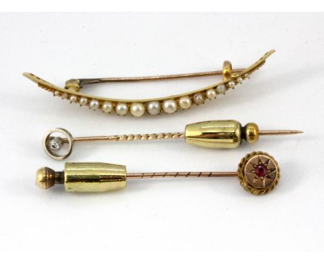 A yellow metal pearl set brooch and two 9ct gold tie pins set with ruby and diamond.
