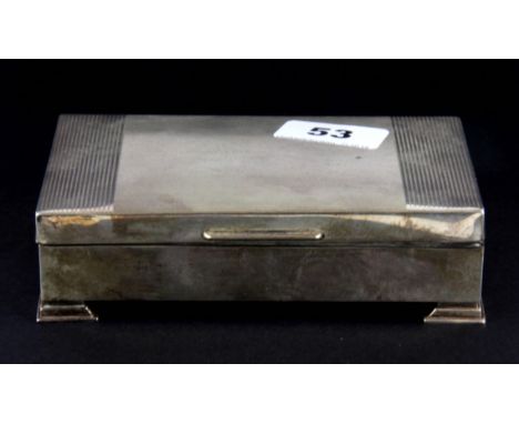 A hallmarked silver cigarette box with engine turned decoration, 15 x 9 x 4cm.