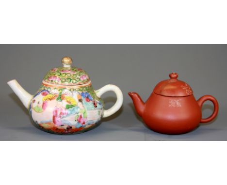 A small 19th Century Chinese famille rose porcelain teapot, H. 7cm, together with a miniature Yixing terracotta teapot, (both