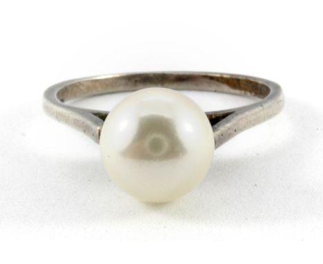 A white metal (tested silver) cultured pearl set ring, (M.5).