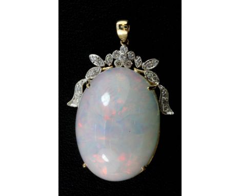 A large 14ct yellow gold pendant set with a 42.59ct opal and diamonds, L. 4cm, opal 2.8 x 2 x 1.5cm.