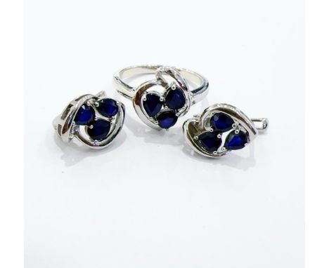 A pair of 925 silver earrings set with oval cut sapphires, L. 1.5cm, together with matching silver and sapphire ring.
