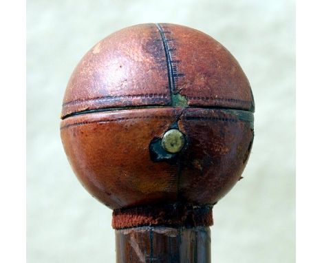 The leather covered spherical handle, in the form of a cricket ball, has a button which when depressed opens to reveal a deco