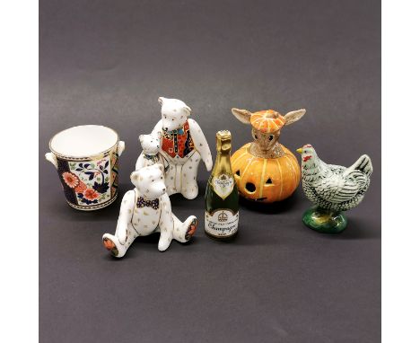 Two Royal Crown Derby bear figures with a Derby miniature ice bucket, a Doulton halloween Bunnykins, Derby champagne bottle a