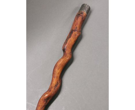 A hallmarked silver handled, naturally twisted wooden walking stick, L. 91cm.