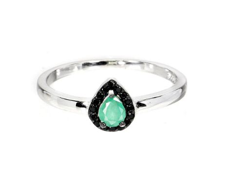 A 925 silver ring set with a pear cut emerald surrounded by black spinels, (P).
