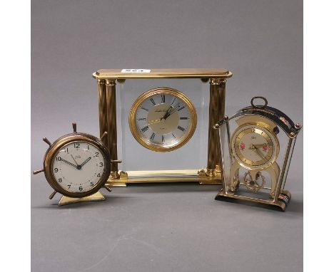 A vintage brass quartz mantel clock, together with two further brass clocks.