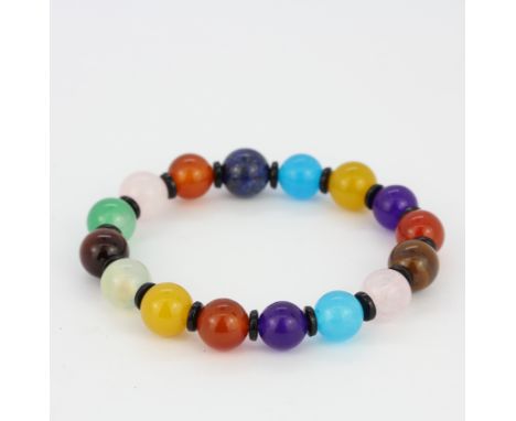 A bracelet set with polished gemstones, including lapis lazuli, rose quartz, tiger's eye, amethyst, etc.